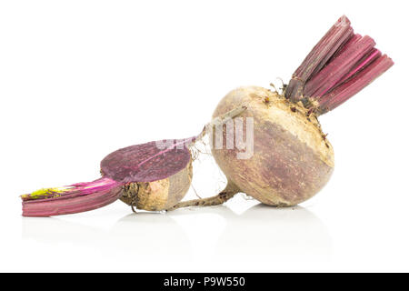 One red beet with a half young bulbs isolated on white background cut tops Stock Photo