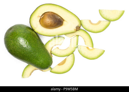 Green smooth avocado set top view isolated on white background bacon variety one whole sliced half with a seed and a lot of slices Stock Photo