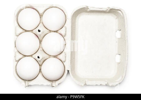 Six white chicken eggs in a paper grey crate isolated on white background top view Stock Photo
