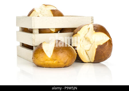 Fresh Bavarian bread buns in a wooden box isolated on white background baked loaves Stock Photo