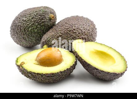 Avocado set isolated on white background two ripe green brown alligator pears and one cut in section halves Stock Photo
