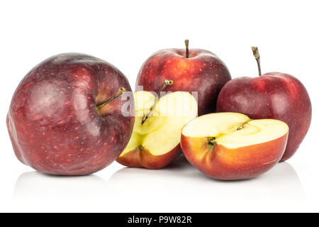 Red delicious three apples and two halves isolated on white background Stock Photo