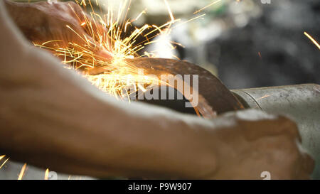 knife sharpening machine and master. Grinding machine. grinding knife using  abrasive stone Stock Photo - Alamy