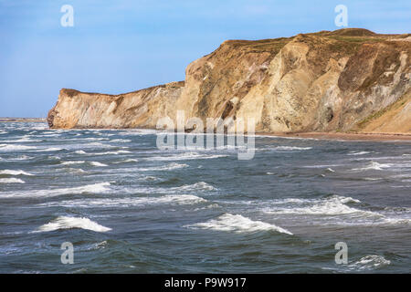 The colourful sandstone cliffs and choppy seas of Havre aux Maison, Magdalen Islands, Quebec Province, Canada. Stock Photo