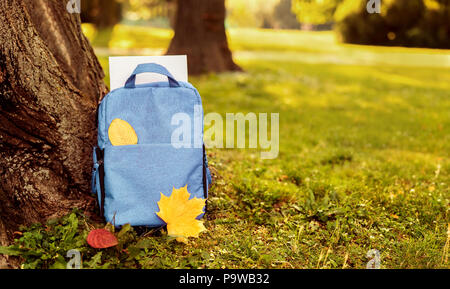 Close up of blue school bag outdoors Stock Photo