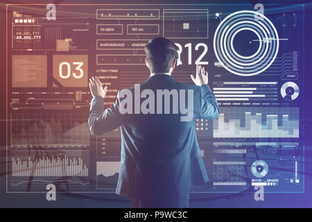 Virtual reality. Clever progressive programmer creating a useful programmer while using a virtual reality device Stock Photo
