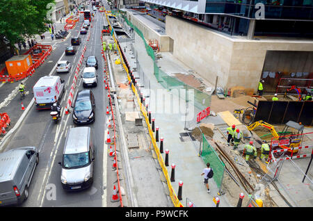 Roadworks and building works disrupting traffic and pedestrians on Farringdon Street, seen from Holborn Viaduct. London, England, UK. Stock Photo