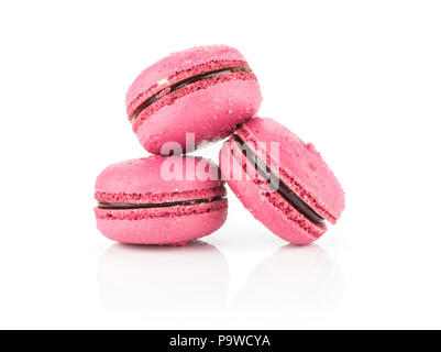 Pink French macarons isolated on white background three with raspberry jam Stock Photo