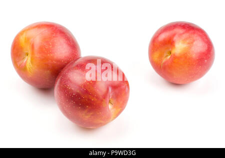 Plums three red orange isolated on white background Stock Photo