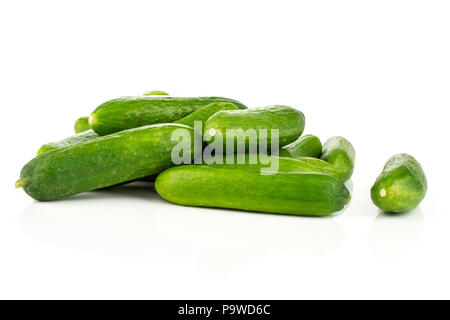 Fresh mini cucumbers heap isolated on white background Stock Photo