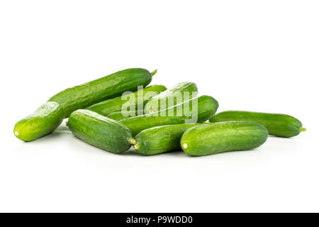 Fresh green mini cucumbers heap isolated on white background Stock Photo