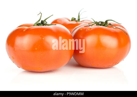 Three red tomato with vine ends isolated on white background fresh whole Stock Photo