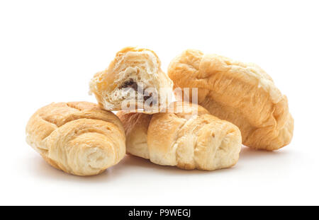 Three baked croissants or cornetto with one half filled with chocolate isolated on white background Stock Photo