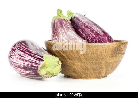 Three striped purple eggplants in a wooden bowl isolated on white background Stock Photo
