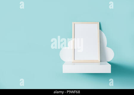 Frame mockup on turquoise wall. Copyspace. Stock Photo