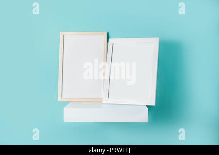 Frame mockup on turquoise wall. Copyspace. Stock Photo
