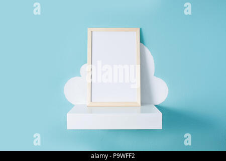 Frame mockup on turquoise wall. Copyspace. Stock Photo