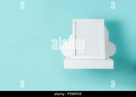 Frame mockup on turquoise wall. Copyspace. Stock Photo