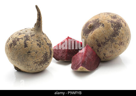 Two beetroot bulbs (raw red beet) and two pieces isolated on white background Stock Photo