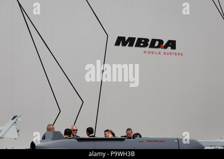 Potential customers get a briefing next to the MBDA Storm Shadow / SCALP missile system outside the defence company's exhibition and hospitality chalet at the Farnborough Airshow, on 16th July 2018, in Farnborough, England. Stock Photo