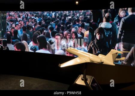 A model of a generic aircraft and the images from a video presentation in the exhibition chalet of United Technologies, at the Farnborough Airshow, on 16th July 2018, in Farnborough, England. United Technologies are the parent company to  Otis,, UTC Climate, Controls & Security, Pratt ＆ Whitney and UTC. Stock Photo