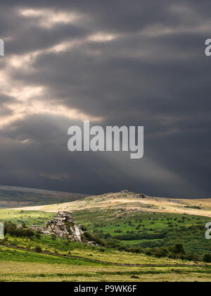 Evening light and dramatic sky over wild Dartmoor in the UK. Stock Photo