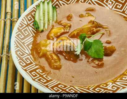 Alleppey fish curry - Kerala Style spicy Fish Curry which is slightly tangy due to the use of raw mangoes or Tamarind. Stock Photo