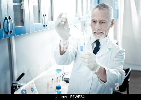 Serious male biologist standing in the lab Stock Photo