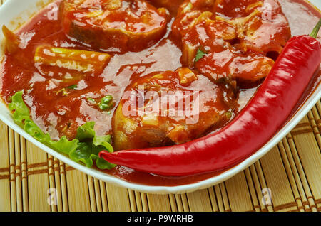 Assam fish curry - Assam Pedas Fish , lassic Peranakan or Nyonya dish Stock Photo