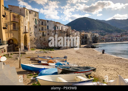 Sicily, Italy - beach with medieval fishermen's houses on the seafront in Cefalu town, Sicily Stock Photo