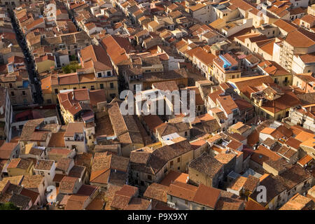 Aerial view of the packed crowded city and red rooftops of Cefalu, Sicily, Italy, Europe