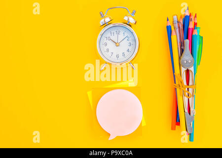 back to school concept minimalistic and creative flat lay scene on yellow with copy space, retro toned Stock Photo