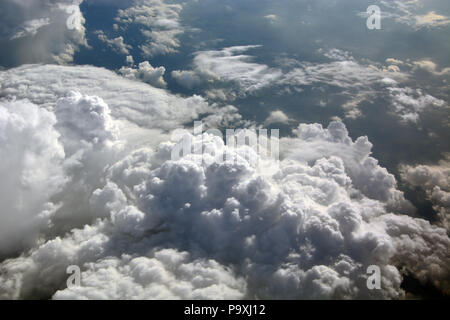 The view from a passenger jet flying high over storm clouds in the Midwestern United States. Stock Photo