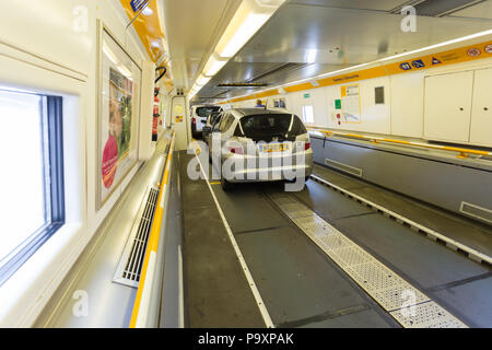 Vehicles parked on the Channel Tunnel, or Chunnel, Shuttle, train carrying them from England to France Stock Photo