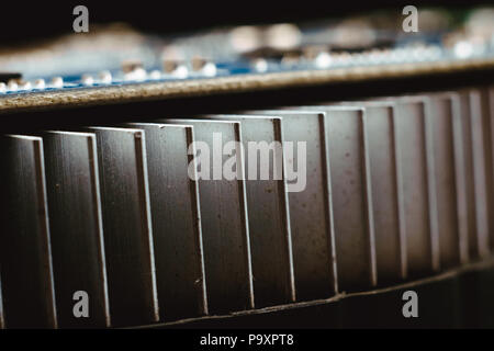 Dust on the computer pc processor cooler with mainboard and computer case fragment. Selective focus. Stock Photo