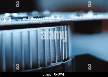 Dust on the computer pc processor cooler with mainboard and computer case fragment. Selective focus. Stock Photo