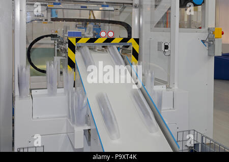 Plastic cup manufacture production in factory Stock Photo