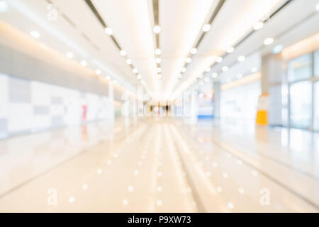 Blur, defocused bokeh background of exhibition hall or convention center hallway. Business trade show event, commercial tradeshow conference seminar Stock Photo