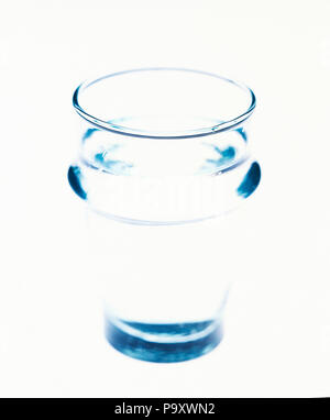 Very transparent Glas of water on a bright white background Stock Photo