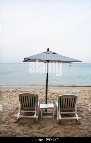 Beach chair with umbrella. Ao Prao, Koh samed. Thailand Stock Photo