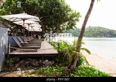 Beach chair with umbrella. Ao Prao, Koh samed. Thailand Stock Photo