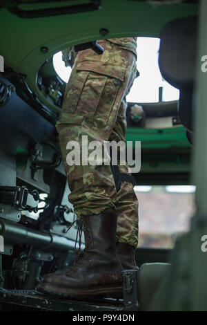 View of a Soldier Standing inside the Military Vehicle. Stock Photo