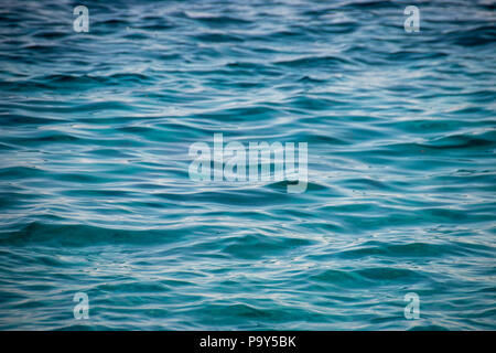 Texture of blue a turquoise colored ocean water surface Stock Photo