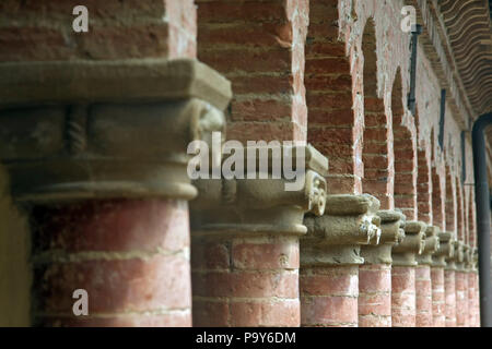 MONTE OLIVETO MAGGIORE, ITALY, May 5, 2009: Old ionic capitals in perspective. Soft selective focus and shallow depth of field in the Benedictine Mont Stock Photo