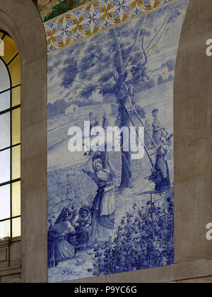 Porto, Portugal - March 4, 2015: Sao Bento railway station with famous tiles from 1905. This panel represents a bucolic scene of the nineteenth centur Stock Photo