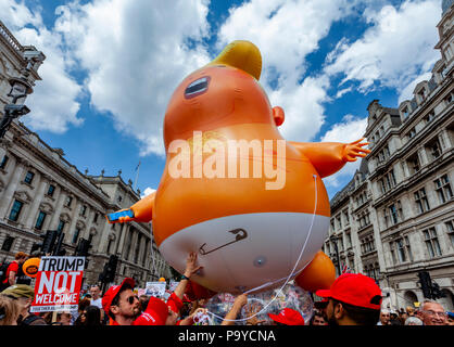 Anti Trump Protestors Carry An ‘Angry Baby’ Inflatable Blimp Mocking The President Through The Streets Of Central London, London, England Stock Photo