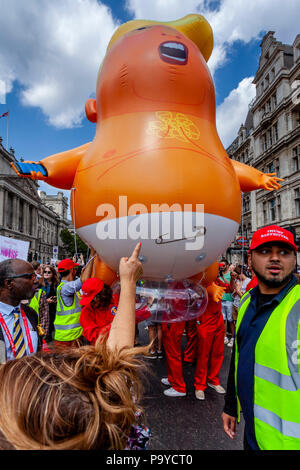 Anti Trump Protestors Carry An ‘Angry Baby’ Inflatable Blimp Mocking The President Through The Streets Of Central London, London, England Stock Photo