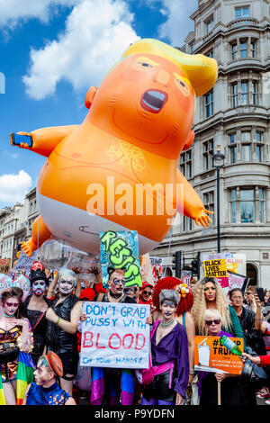 Anti Trump Protestors Carry An ‘Angry Baby’ Inflatable Blimp Mocking The President Through The Streets Of Central London, London, England Stock Photo