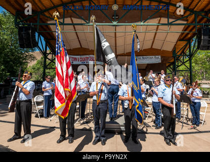 American Legion flag guard; United States Air Force Brass Band plays a Fourth of July Concert in the Riverside Park band stand; Salida; Colorado; USA Stock Photo