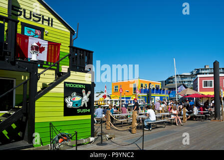 Fisherman's Wharf in Victoria, British Columbia, Canada.  Restaurants and boardwalk in Victoria, BC, Canada. Stock Photo